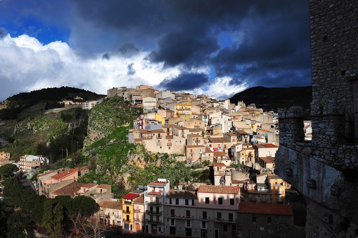 Caccamo, Sicily: A Town on a Hillside Under Dramatic Skies