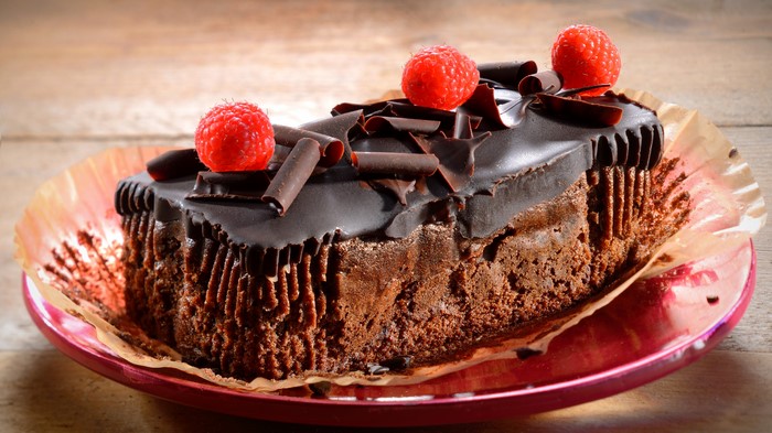 Chocolate cake with raspberries on a plate