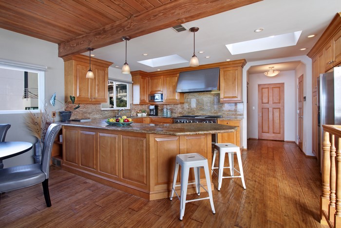 Kitchen with wooden cabinets and island