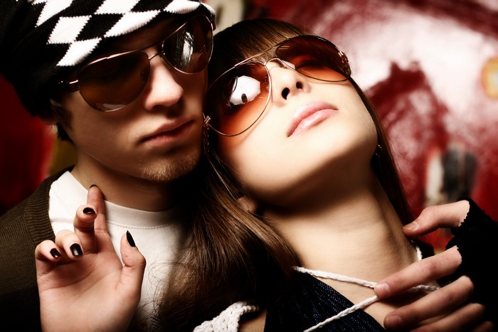 Couple wearing sunglasses, man with beanie