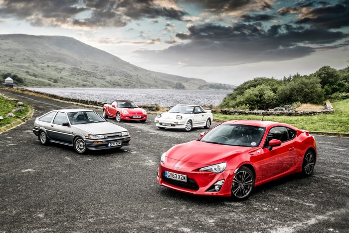 Four Toyota Sports Cars by a Lake