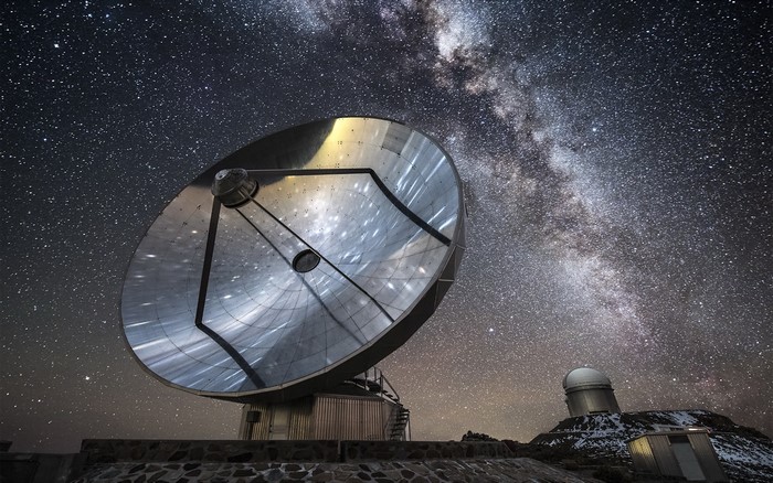 Satellite dish under the Milky Way and stars