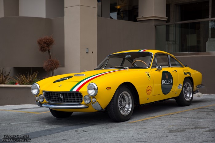 Yellow 1963 Ferrari 250 Lusso with Rolex and Shell decals