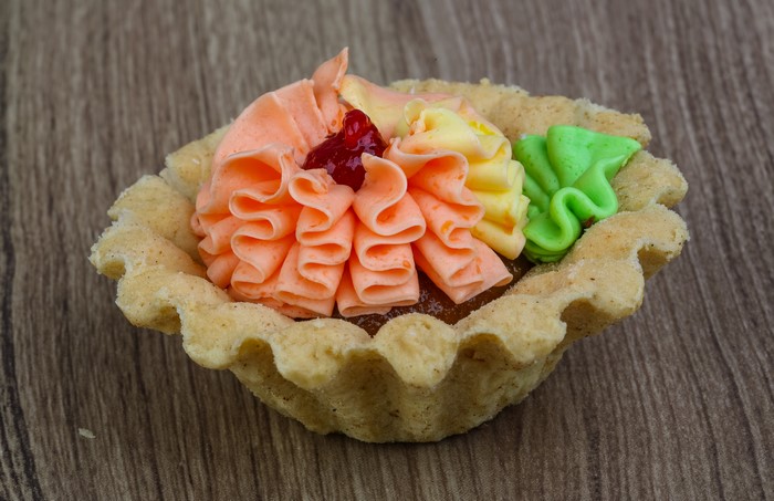 Little cakes with colorful frosting