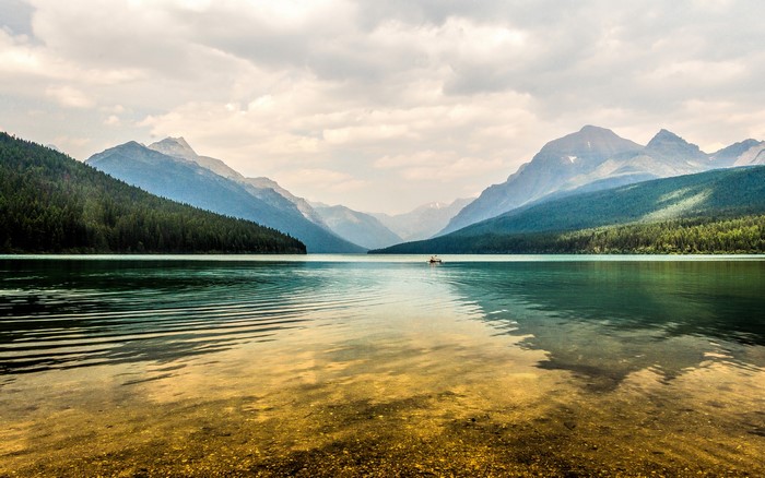 Kayaker on Bowman Lake, Glacier National Park, Montana