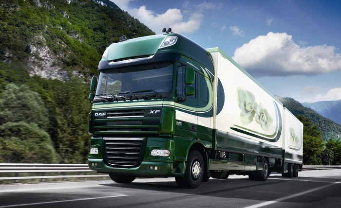 Green DAF XF105 Truck in Motion