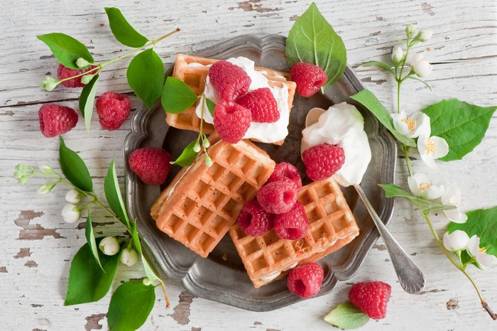 Waffles with Raspberries and Cream on a Plate