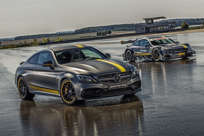 Two Mercedes-Benz AMG C 63 Coupe cars on a wet track