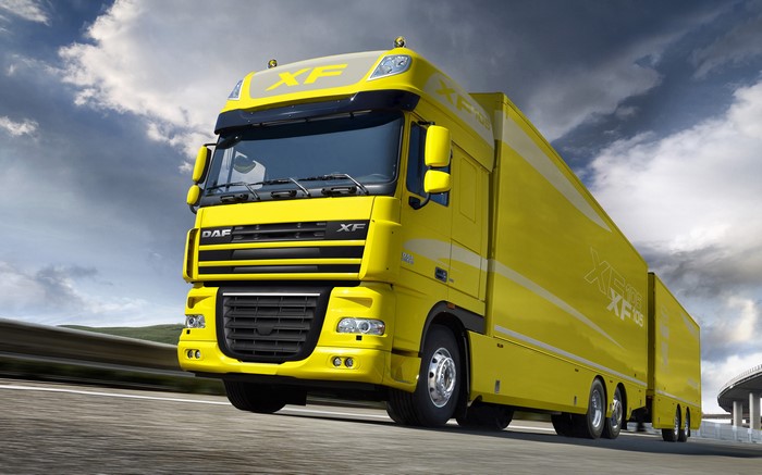 Yellow DAF XF105 Truck in Motion
