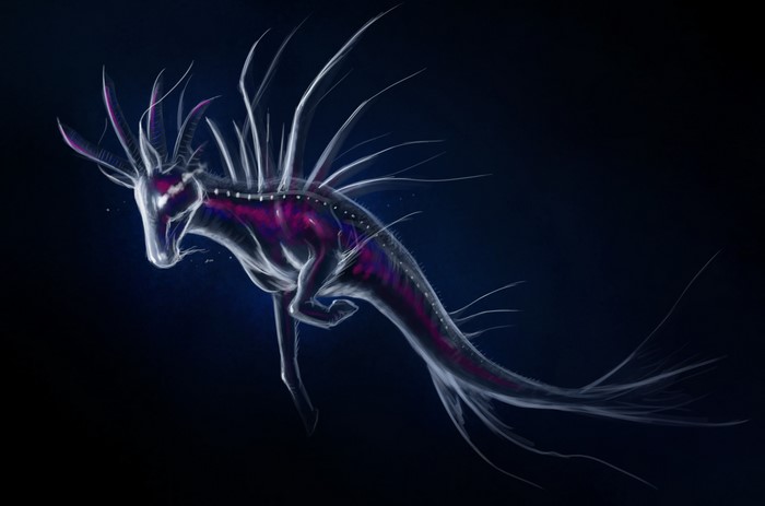 Bioluminescent creature in dark water