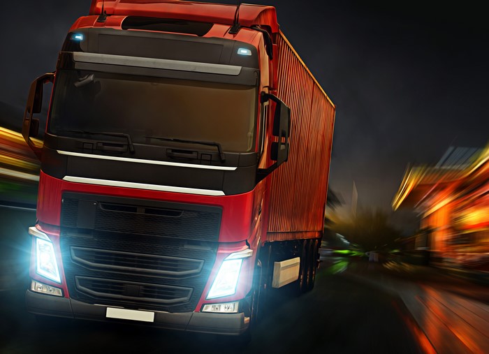 Red Truck in Motion at Night