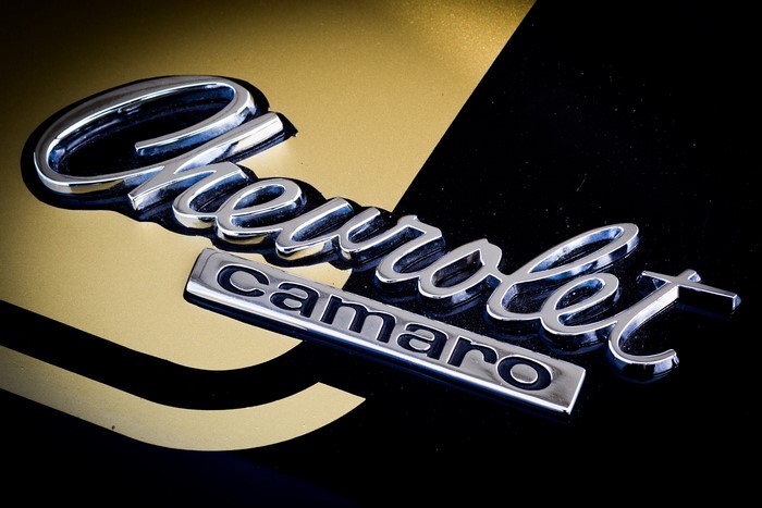 Chevrolet Camaro Emblem on Black and Gold Car
