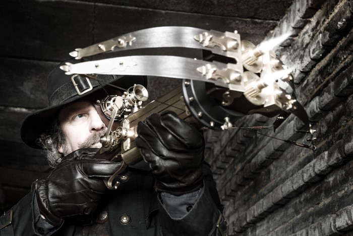 Man in Steampunk Hat with Crossbow
