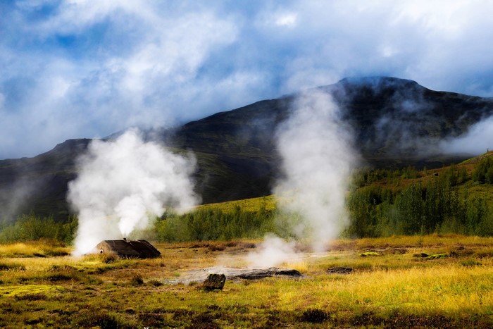 Geothermal activity with a small hut in Iceland