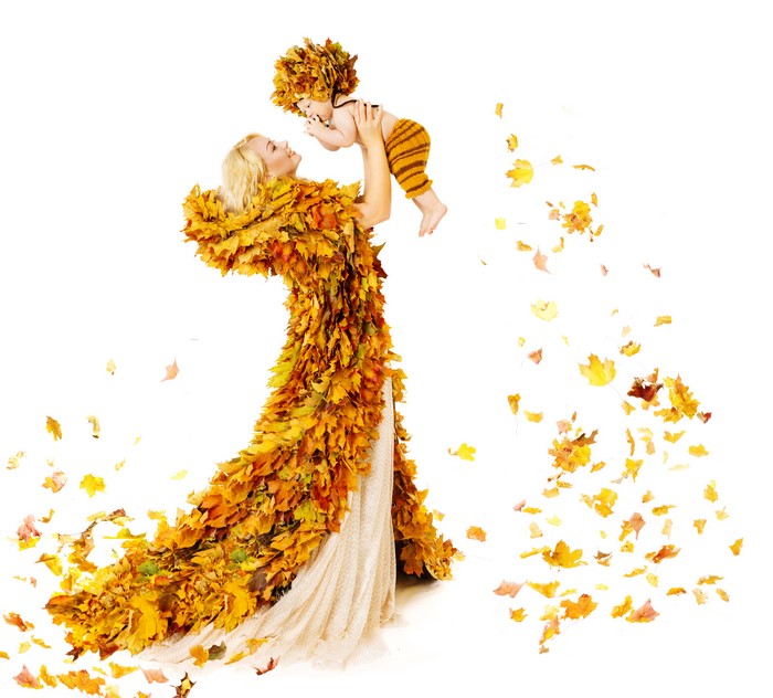 Woman in Autumn Leaf Dress Holding Baby