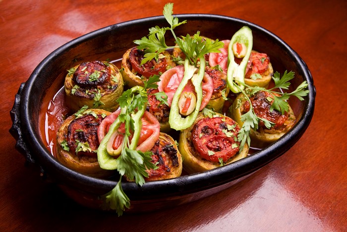 Stuffed vegetables with tomatoes and parsley in a bowl