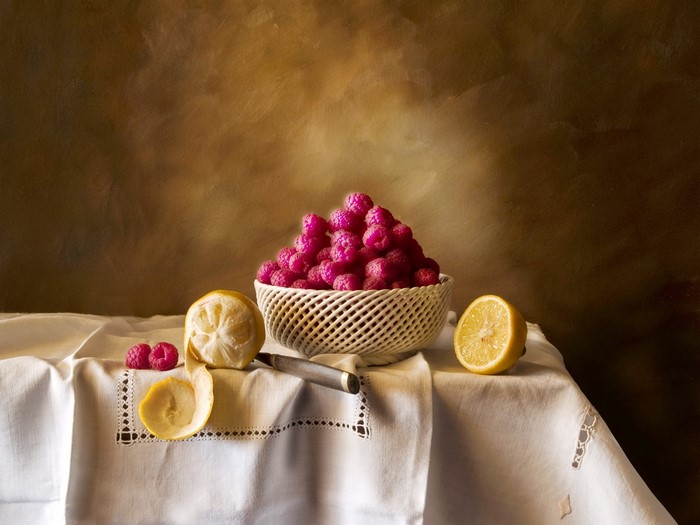 Still-life with raspberries and lemons