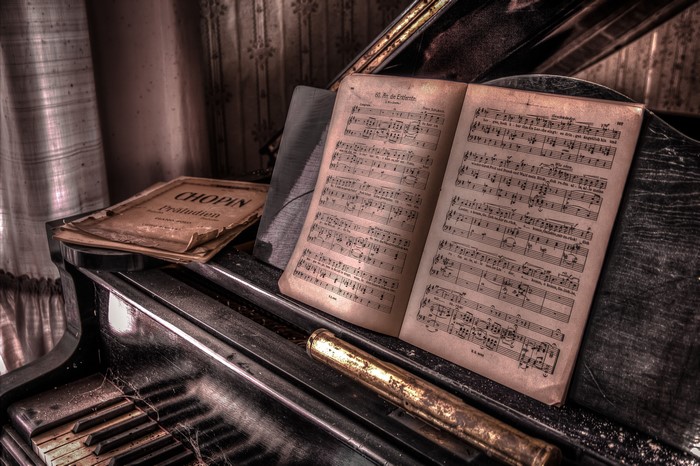 Chopin Préludes sheet music on an old piano