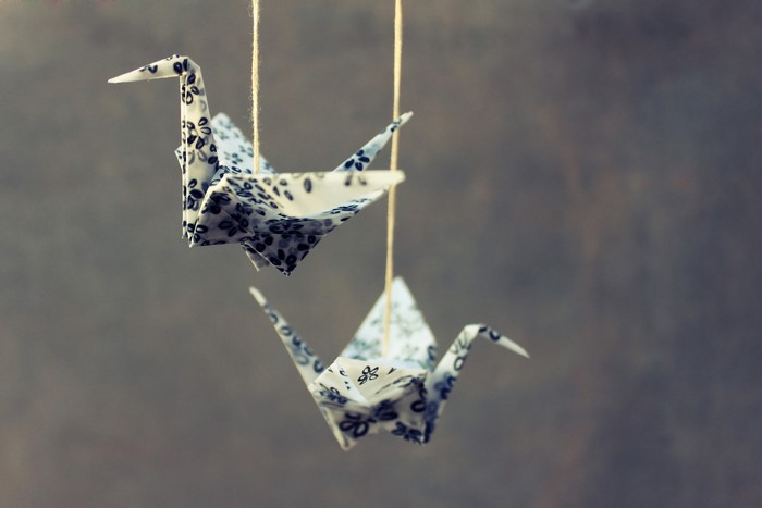 Origami cranes hanging on strings