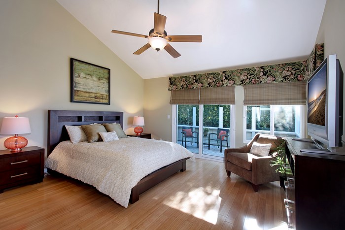 Bedroom with bed, armchair, and TV