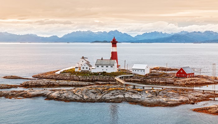 Lighthouse and buildings on rocky island, Norway