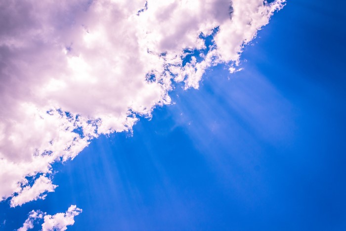 Sky with Clouds and Rays of Light