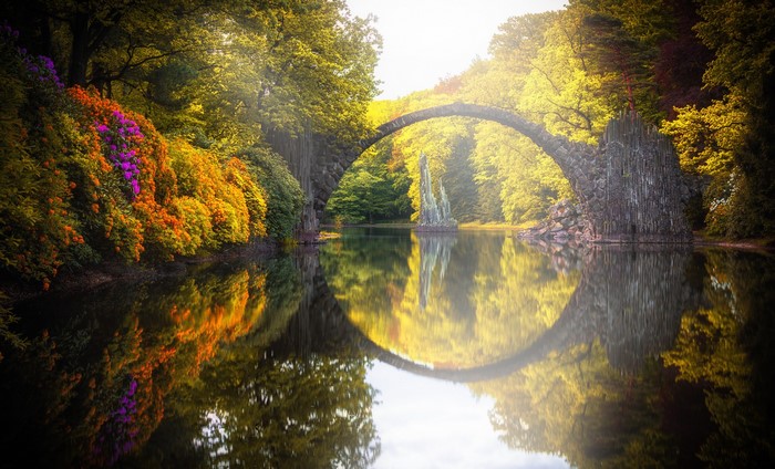 Rakotzbrücke bridge over a lake with reflections