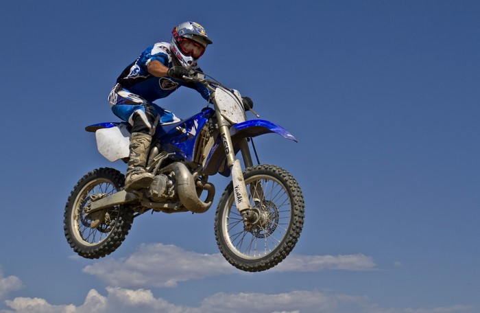 Motorcyclist in mid-air jump