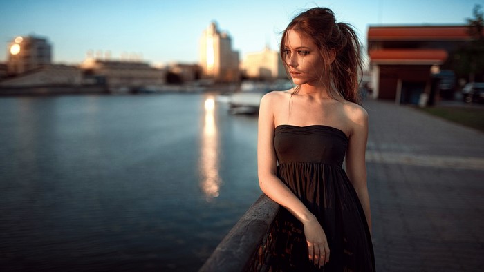 Kseniya Kokoreva by the river in a black dress