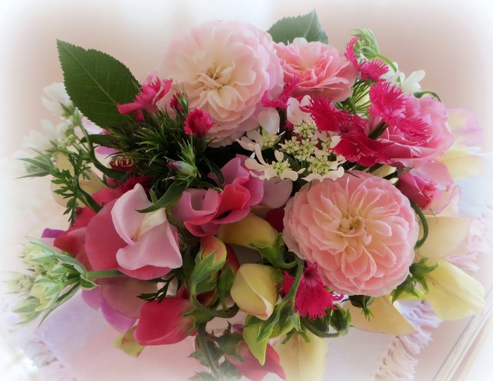 Pink and white flower bouquet with roses and carnations