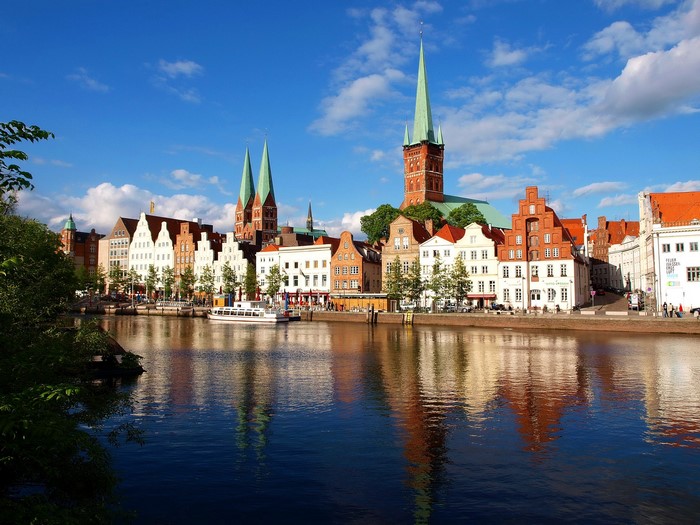 Lubeck Germany riverfront with historic buildings and churches