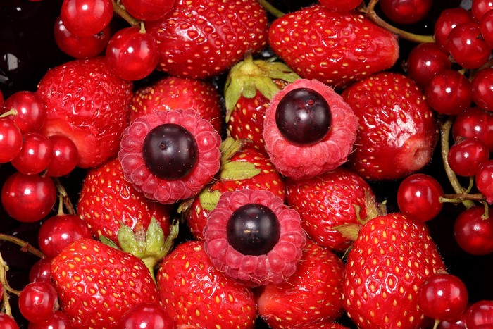 4K close-up of strawberries, raspberries, and currants