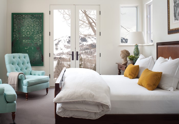 Bedroom with a view of snowy mountains