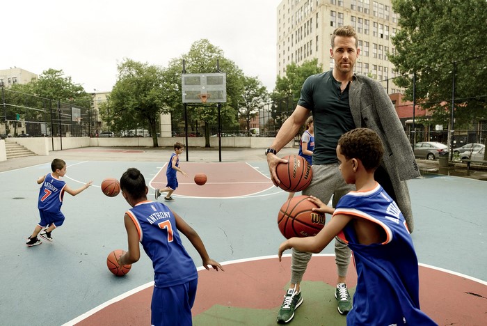 Ryan Reynolds with boys playing basketball