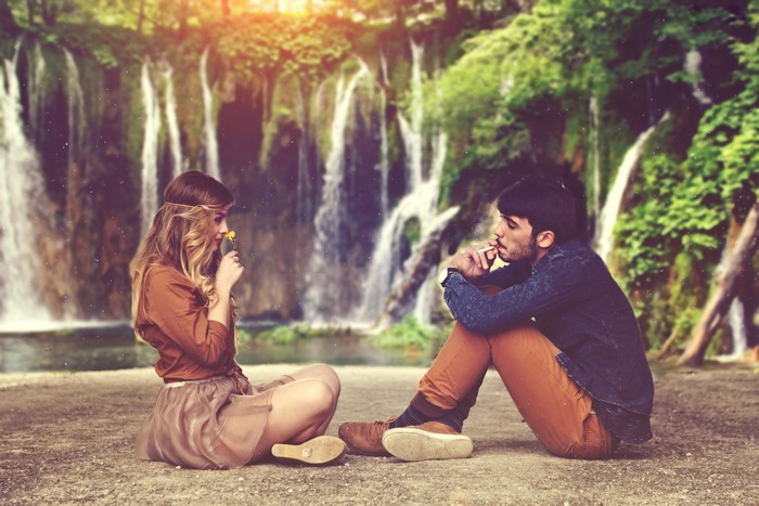 Couple sitting by waterfalls, Alessandro Di Cicco