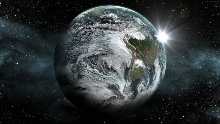 Earth from space with sun rising