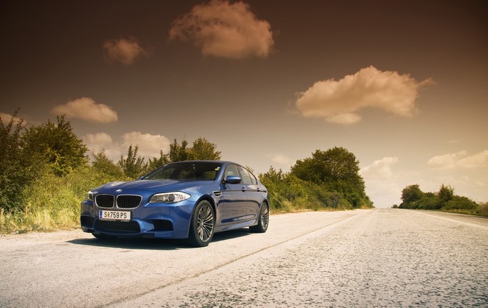 Blue BMW M5 F10 on a Road