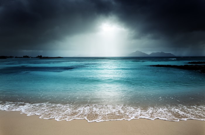 Sea and beach under stormy sky