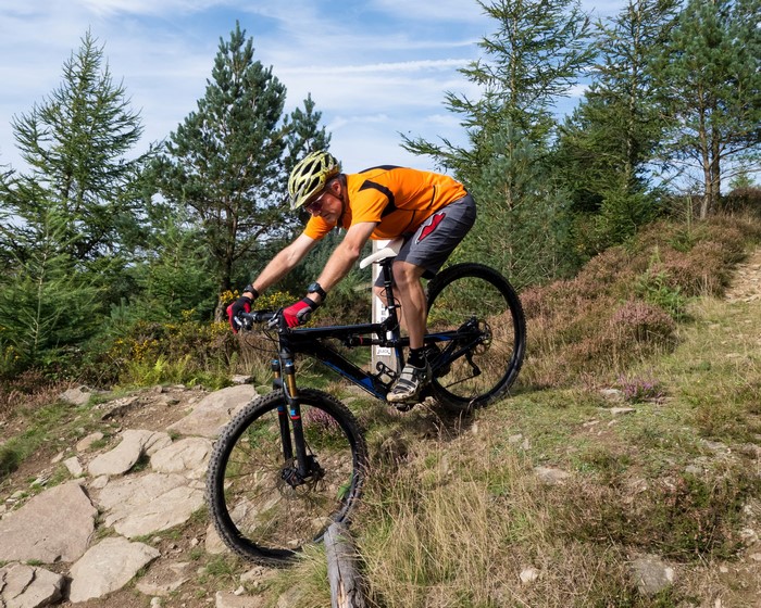 Man riding a mountain bike on a rocky trail