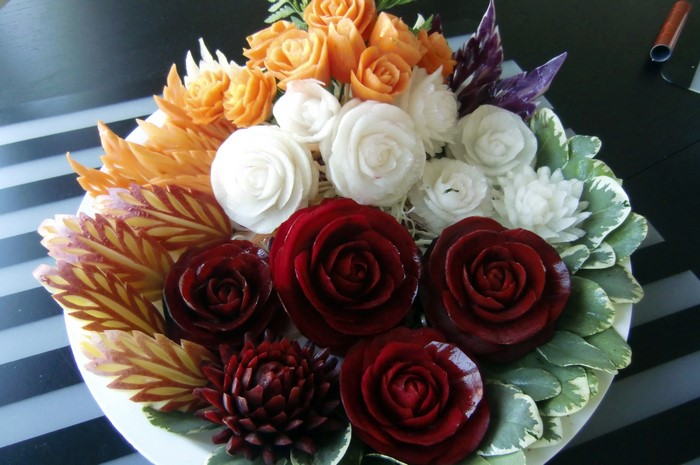 Carved vegetables and fruits arranged as flowers