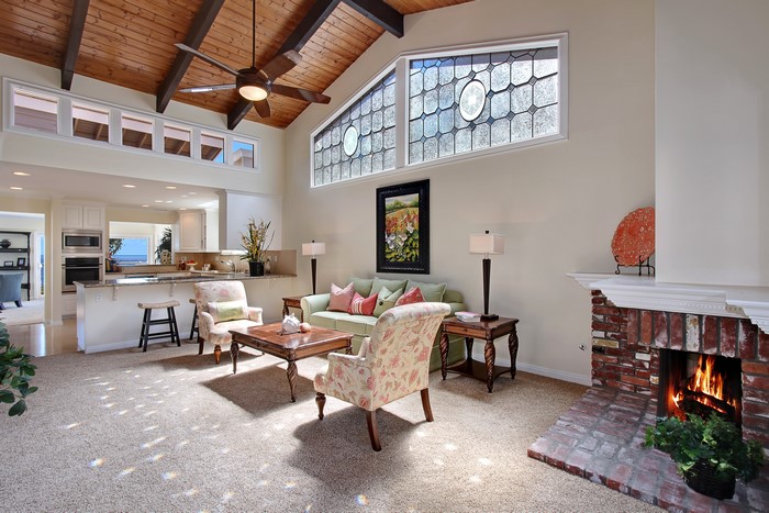 Living room with fireplace and vaulted ceiling