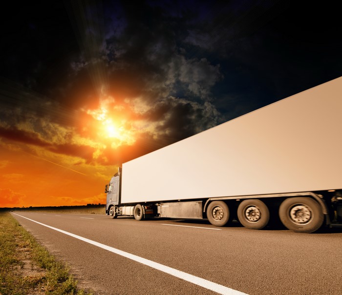 Truck on a highway at sunset