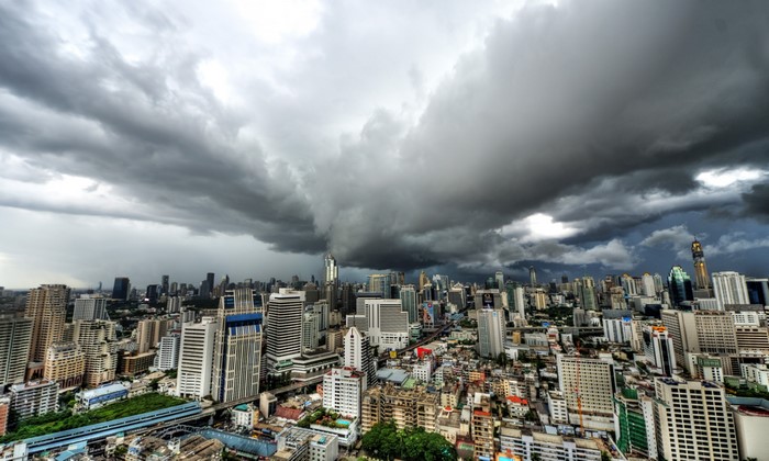Bangkok cityscape under stormy clouds