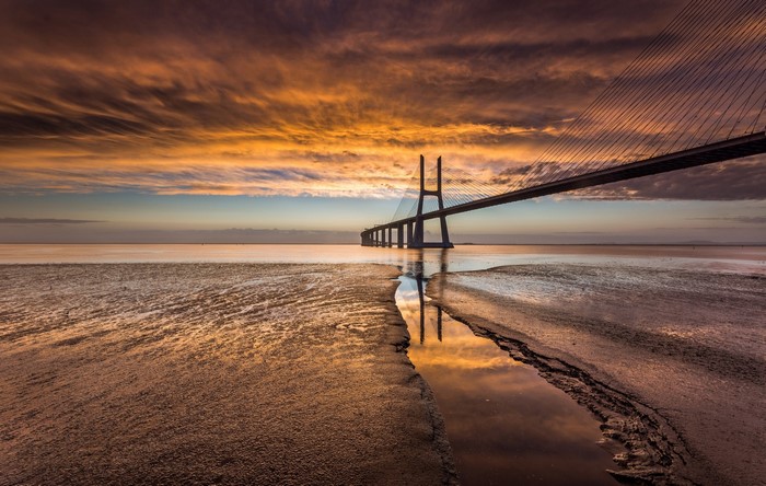 Vasco da Gama Bridge over Tagus River at sunset