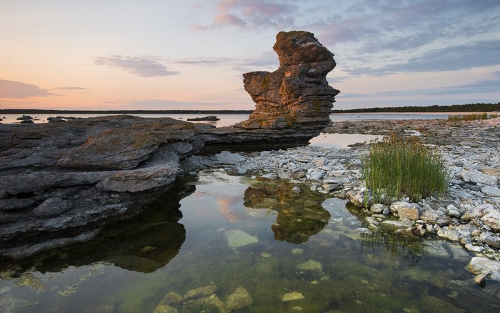 Rocky coastline with sea stacks at sunset in Sweden