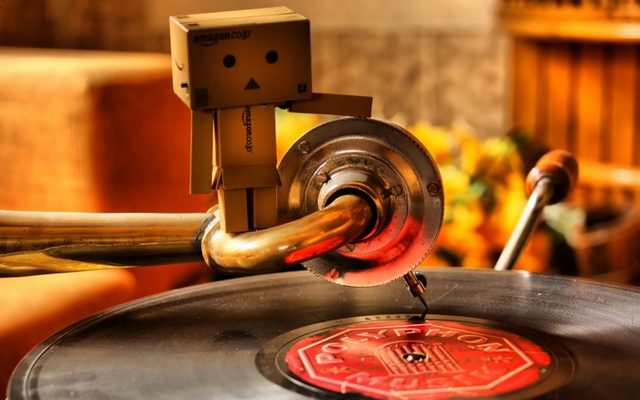 Danbo robot on a vintage gramophone with vinyl record