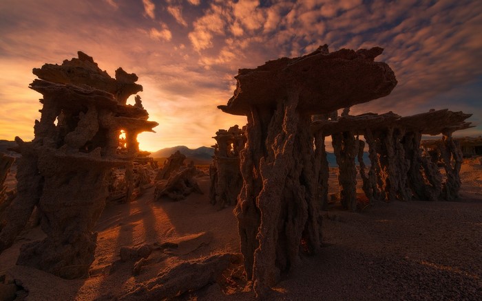 Tufa formations at sunrise with dramatic sky