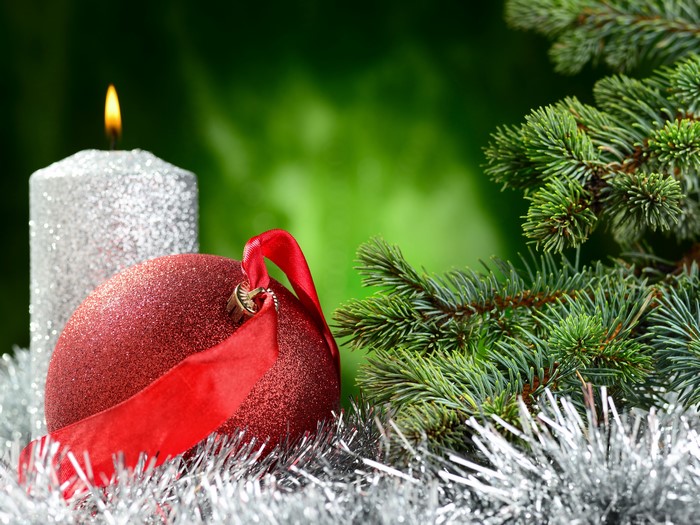 Christmas candle, ornament, and pine branches