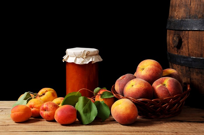 Peaches and Apricot Jam in a Jar with a Barrel