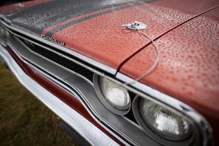 Plymouth car hood with rain drops